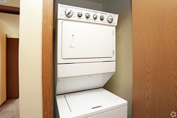 A washer and dryer in a room